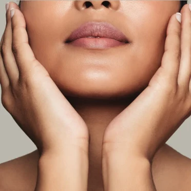 women-gently-touching-her-face